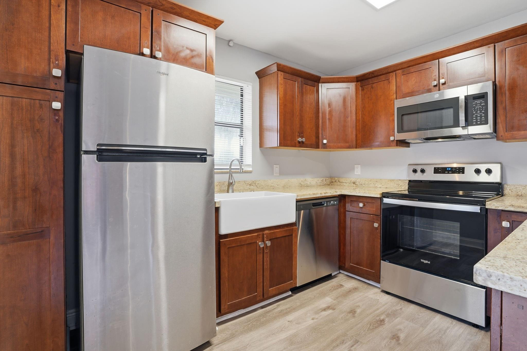 7600 Courtyard Run West Boca Raton, FL 33433 - Photo 16 of 34 a kitchen with stainless steel appliances a refrigerator stove and microwave