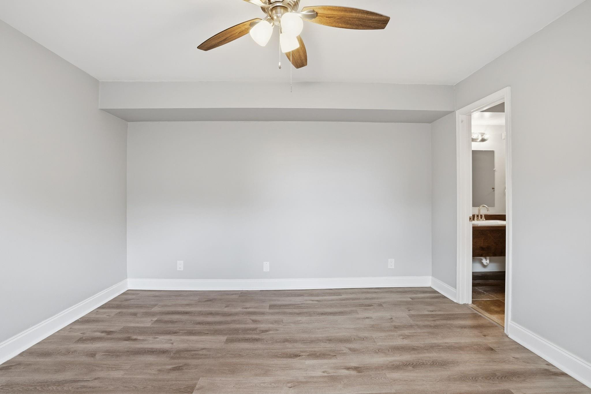 7600 Courtyard Run West Boca Raton, FL 33433 - Photo 19 of 34 a view of an empty room with wooden floor