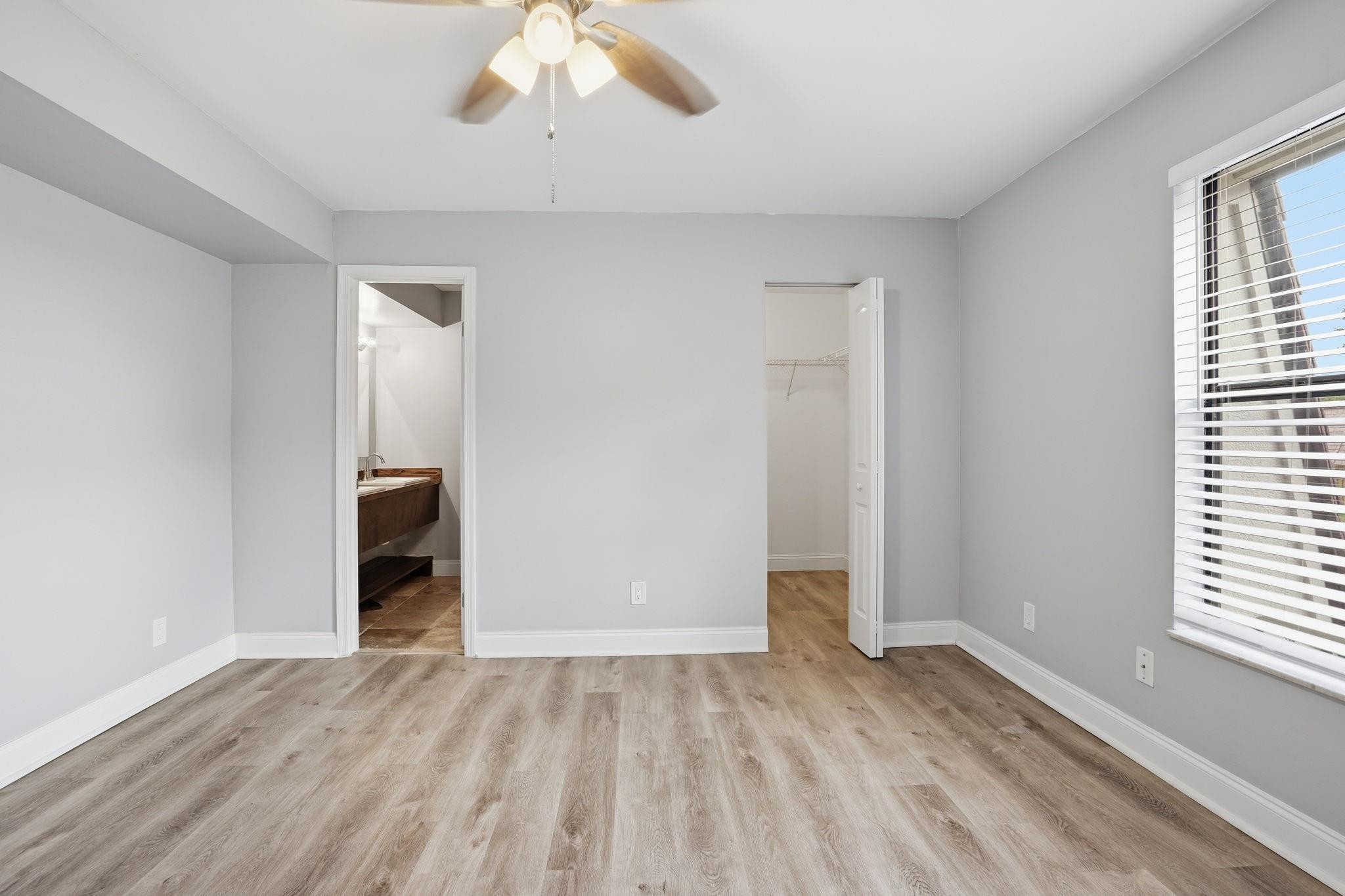 7600 Courtyard Run West Boca Raton, FL 33433 - Photo 20 of 34 wooden floor in an empty room with a window