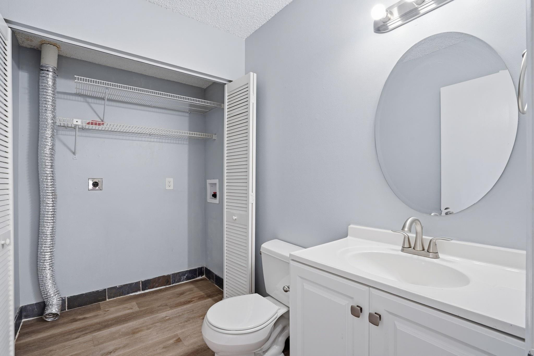 7600 Courtyard Run West Boca Raton, FL 33433 - Photo 24 of 34 a bathroom with a sink a toilet and a mirror