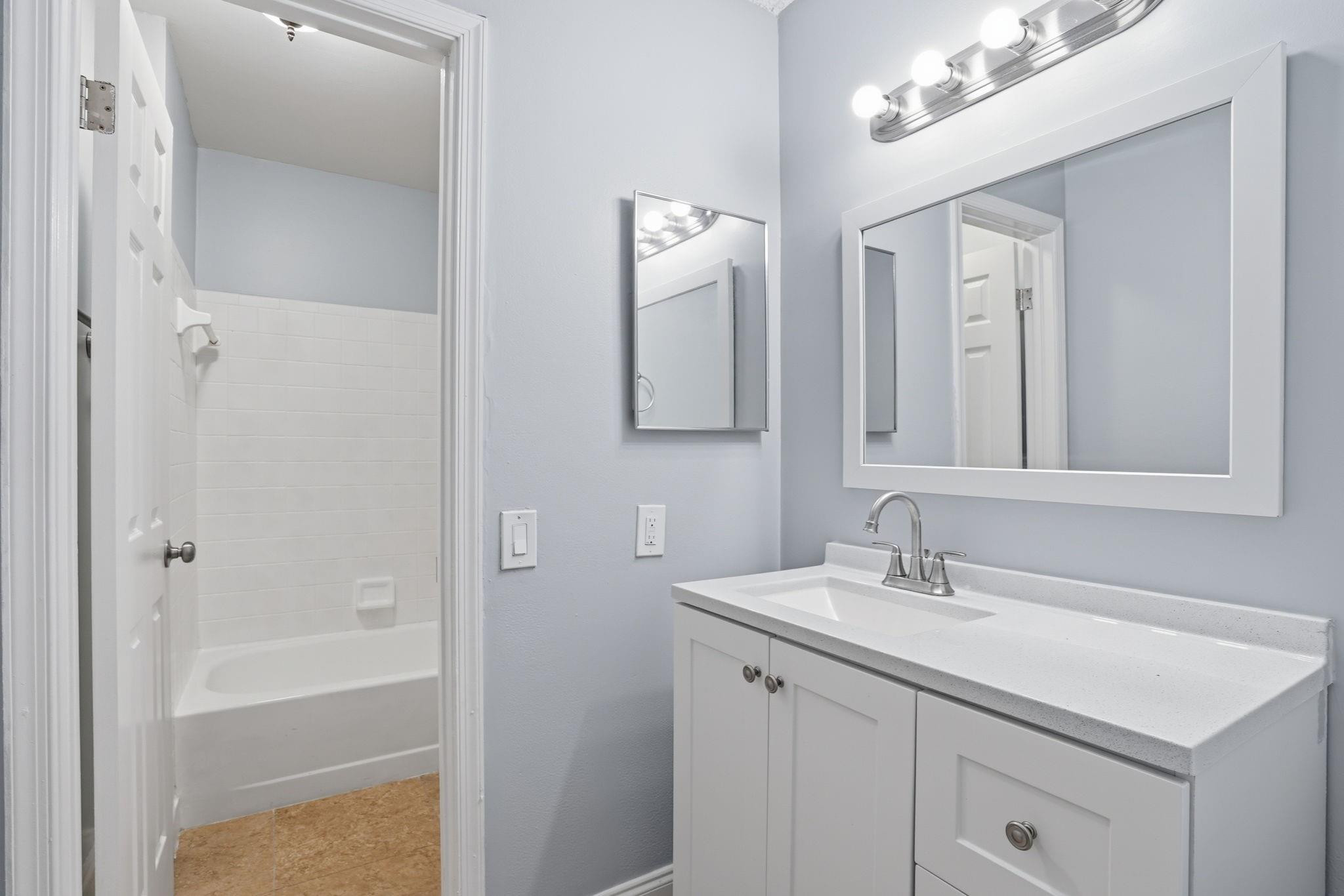 7600 Courtyard Run West Boca Raton, FL 33433 - Photo 27 of 34 a bathroom with a double vanity sink mirror and