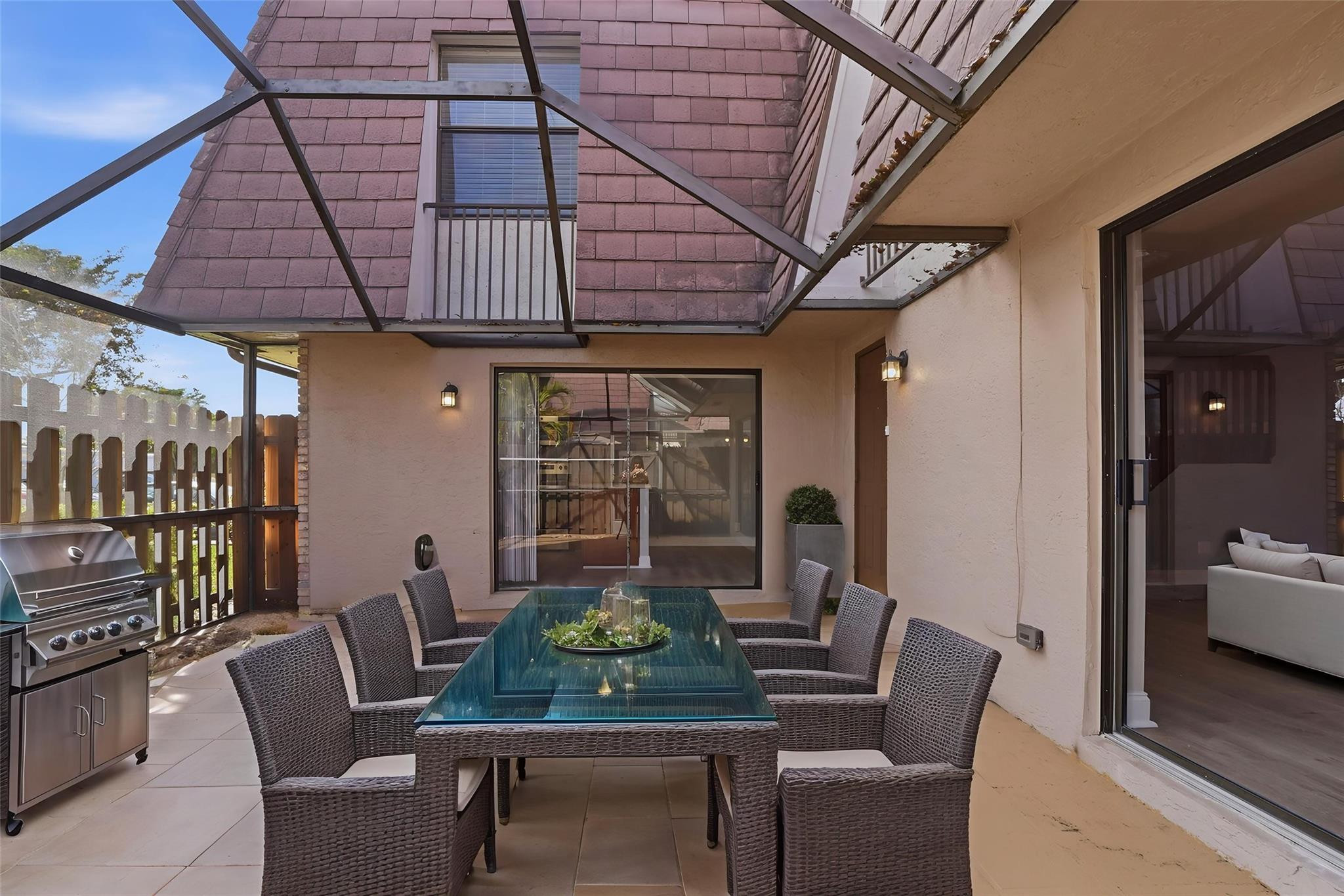 7600 Courtyard Run West Boca Raton, FL 33433 - Photo 29 of 34 a view of a dining room with furniture and window