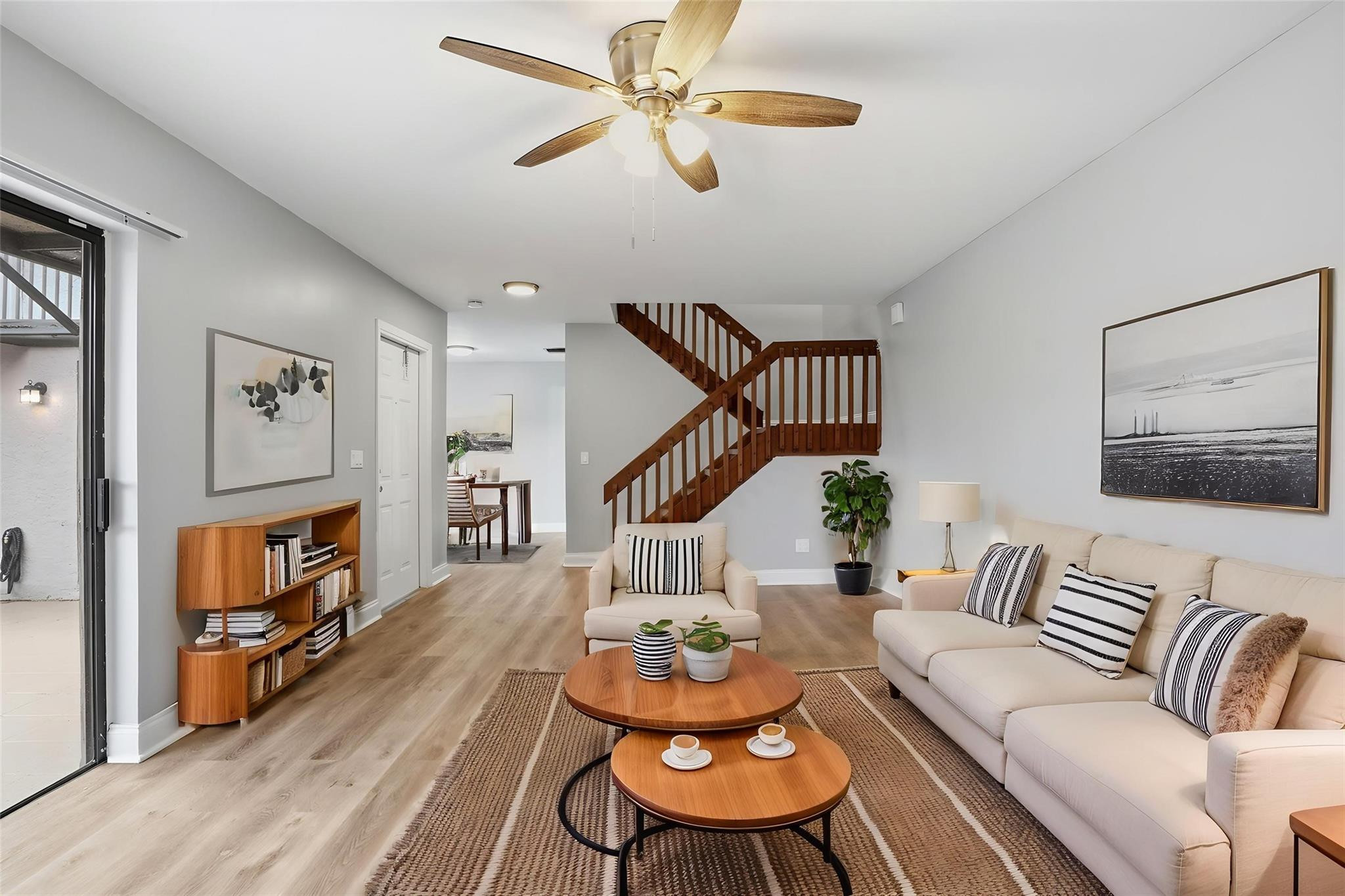 7600 Courtyard Run West Boca Raton, FL 33433 - Photo 3 of 34 a living room with furniture and wooden floor