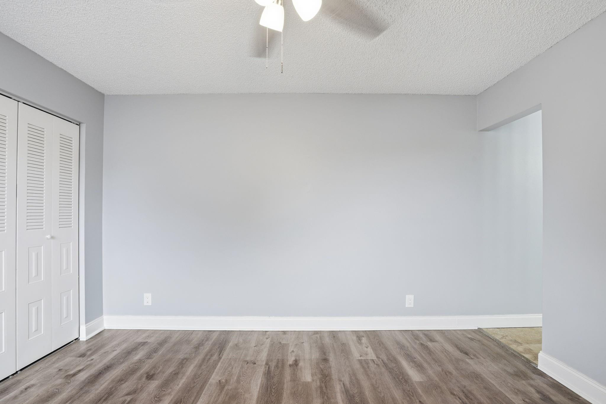 7600 Courtyard Run West Boca Raton, FL 33433 - Photo 8 of 34 a view of an empty room and wooden floor