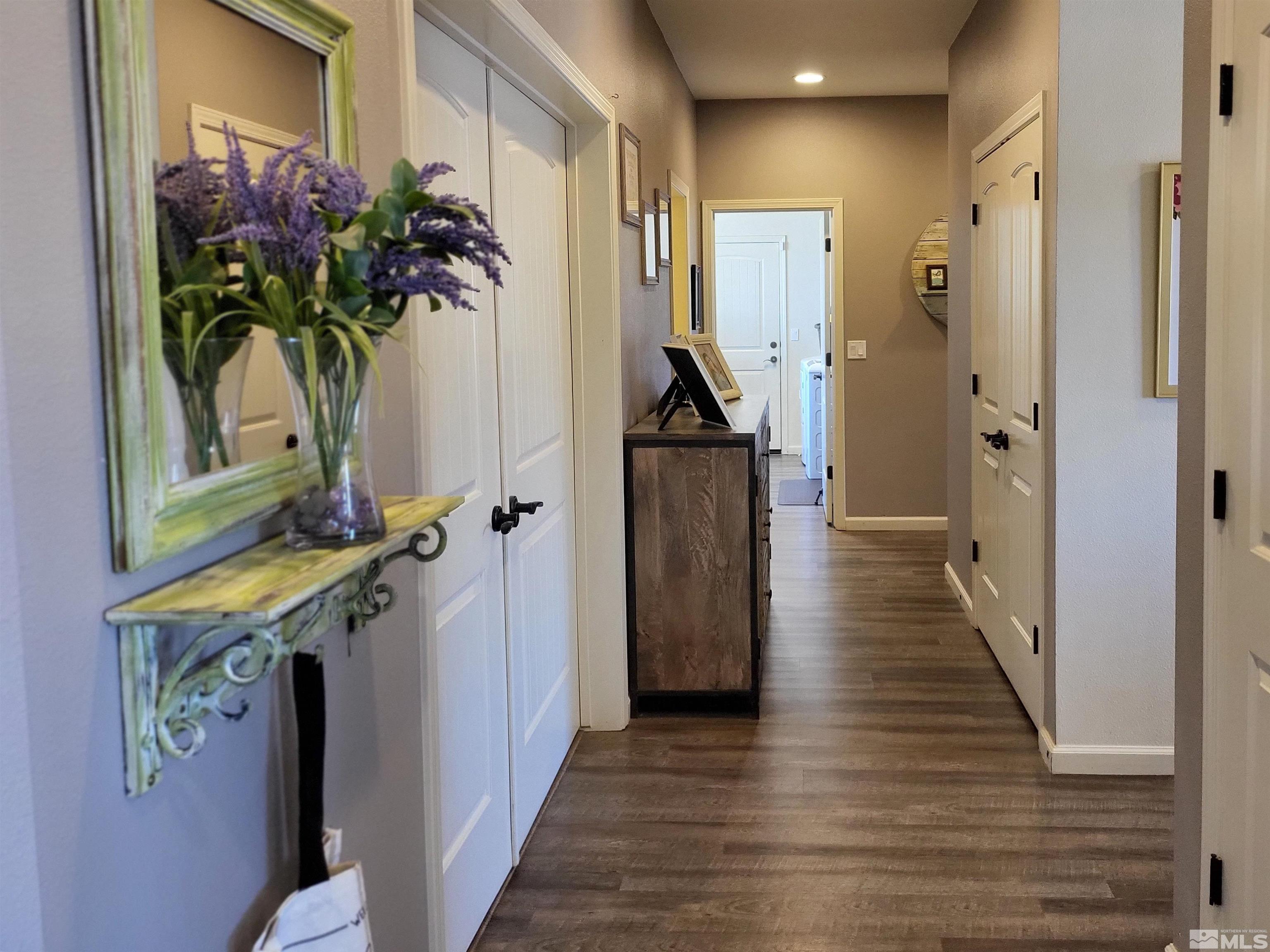 200 Pinto Ranch Court Reno, NV 89510 - Photo 12 of 37 a view of a hallway with wooden floor and front door