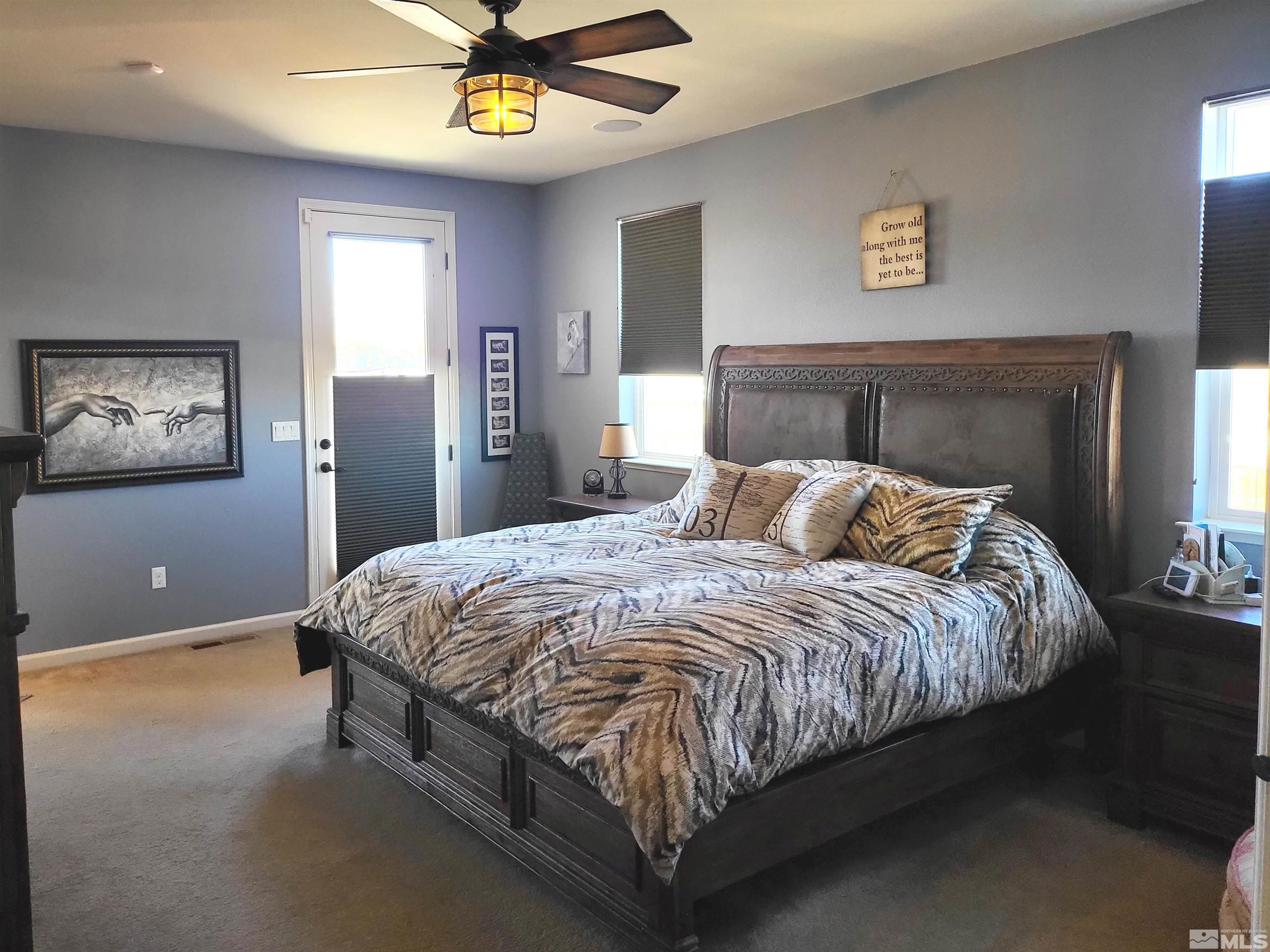 200 Pinto Ranch Court Reno, NV 89510 - Photo 14 of 37 a bedroom with a bed and a chandelier