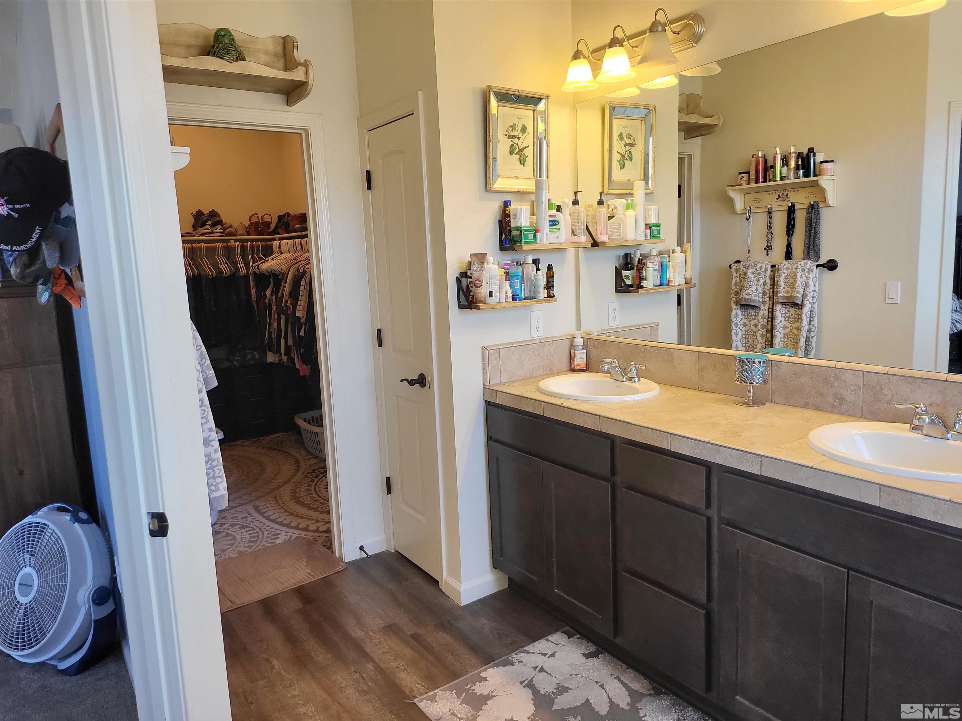 200 Pinto Ranch Court Reno, NV 89510 - Photo 15 of 37 a en suite bathroom with a sink and mirror