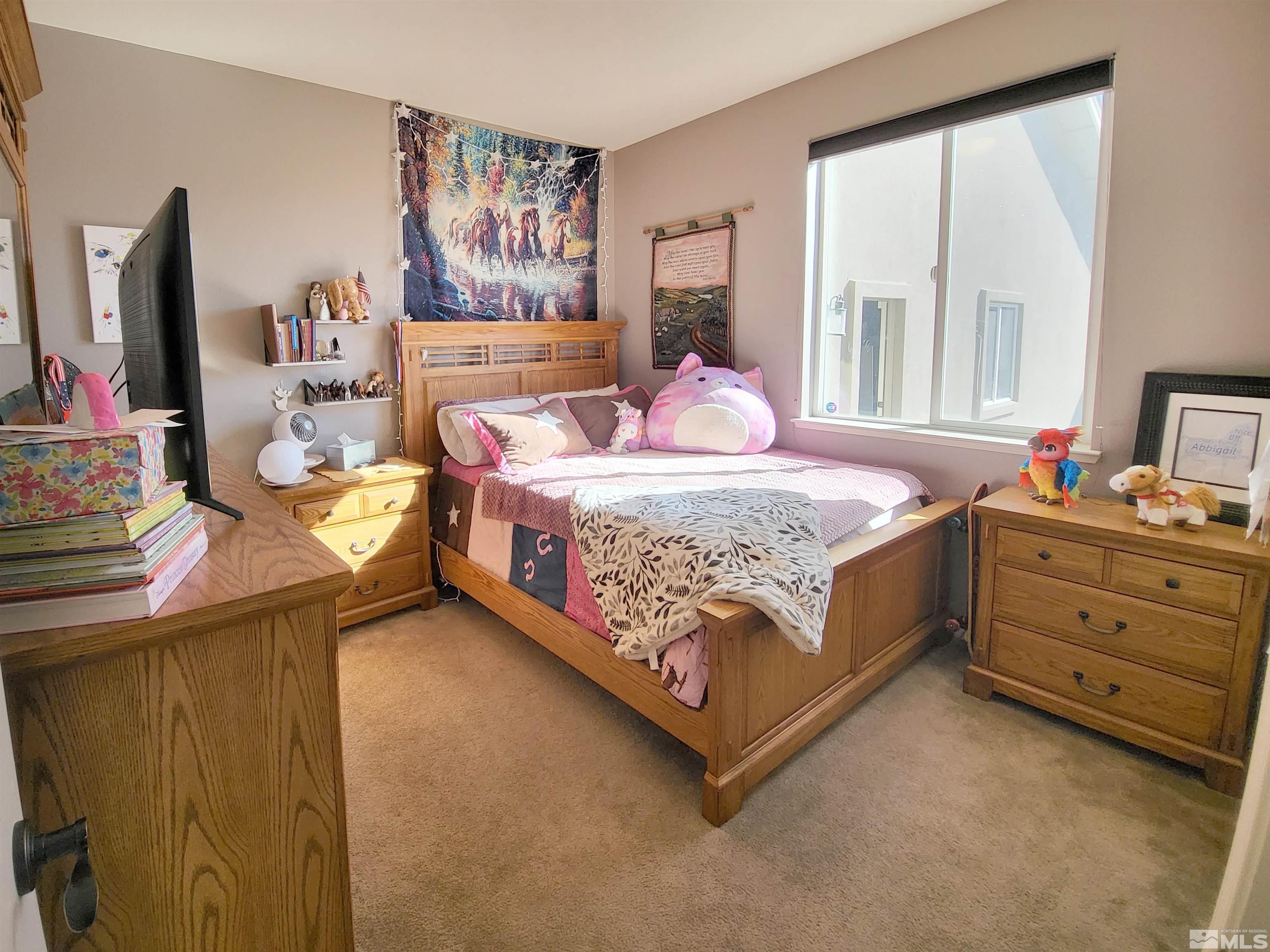 200 Pinto Ranch Court Reno, NV 89510 - Photo 17 of 37 a bed room with a bed and a dresser