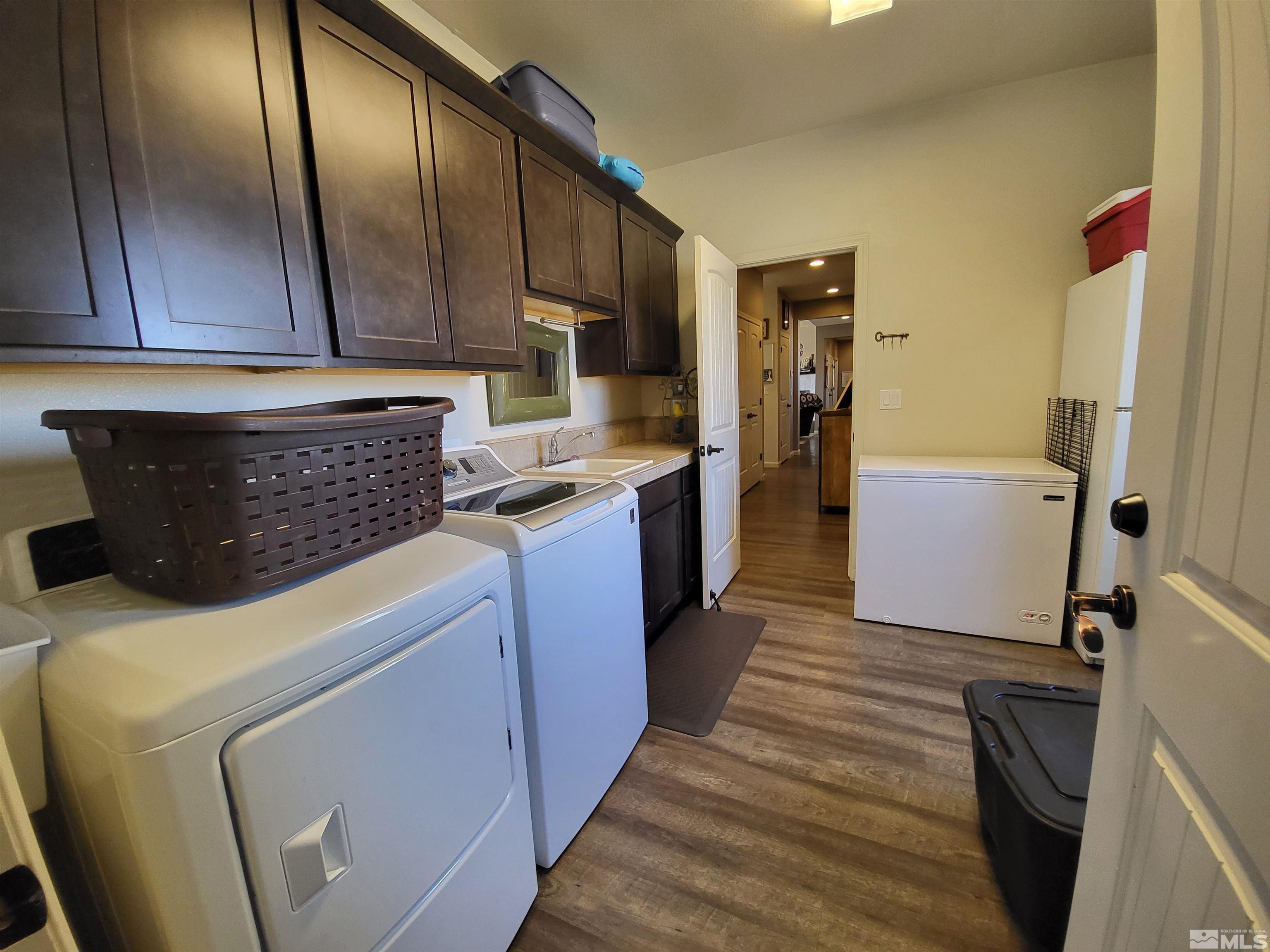 200 Pinto Ranch Court Reno, NV 89510 - Photo 20 of 37 a kitchen with a sink a refrigerator and cabinets