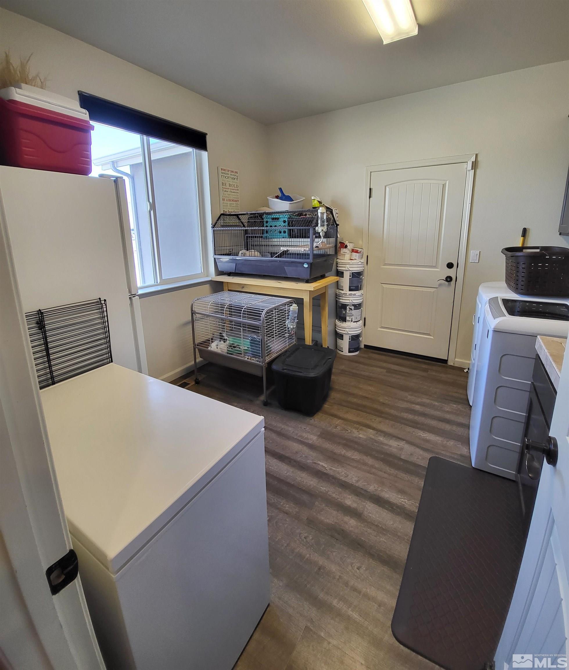 200 Pinto Ranch Court Reno, NV 89510 - Photo 21 of 37 a kitchen with a refrigerator and a stove top oven