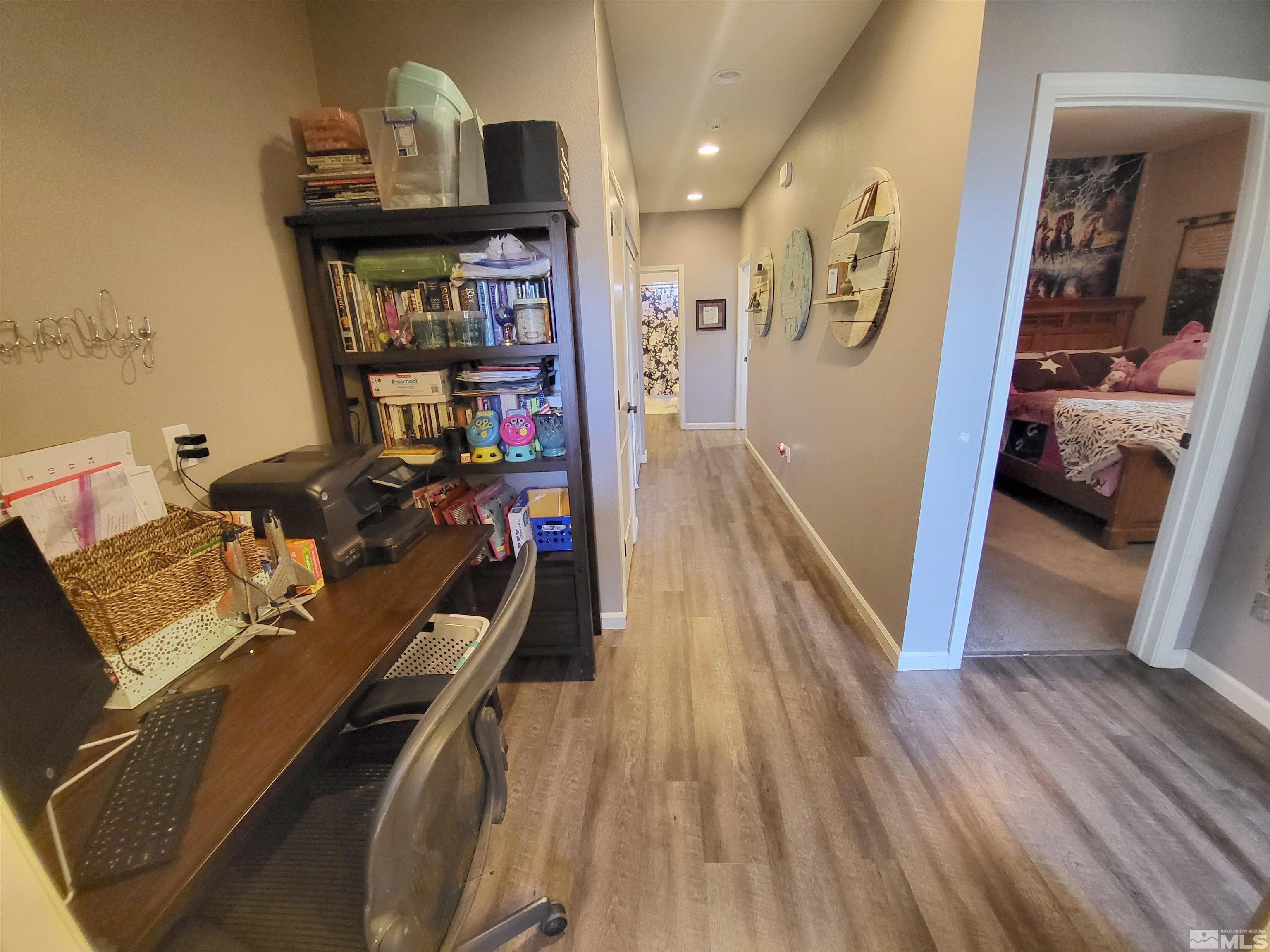 200 Pinto Ranch Court Reno, NV 89510 - Photo 22 of 37 a view of a workspace with furniture and wooden floor