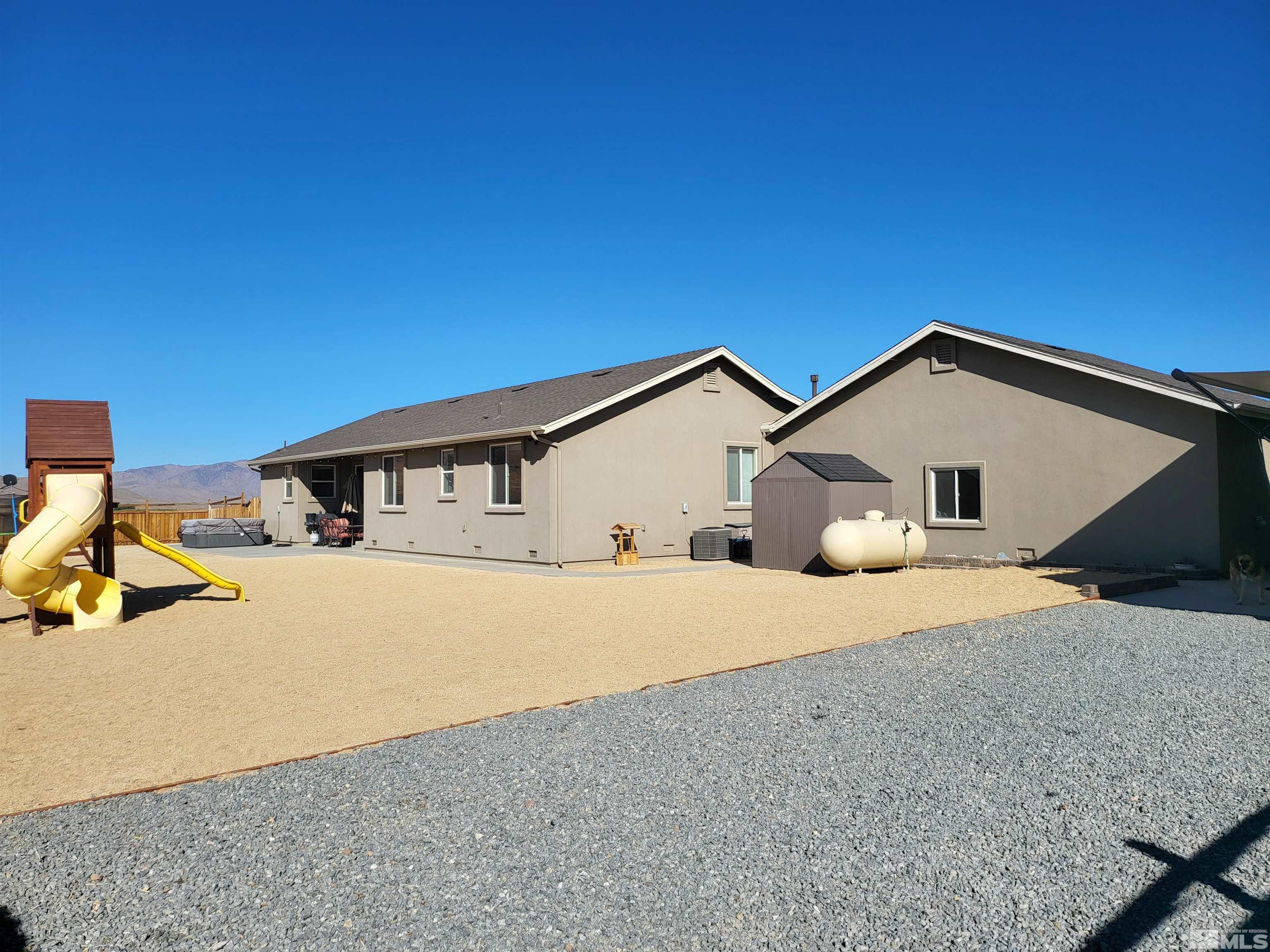 200 Pinto Ranch Court Reno, NV 89510 - Photo 26 of 37 a front view of house with yard and trees in the background