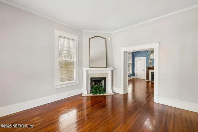 a view of a porch with wooden floor and windows