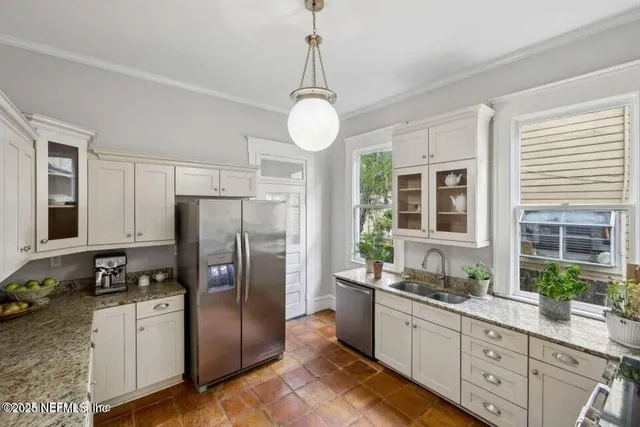 a bathroom with a toilet a sink and a mirror