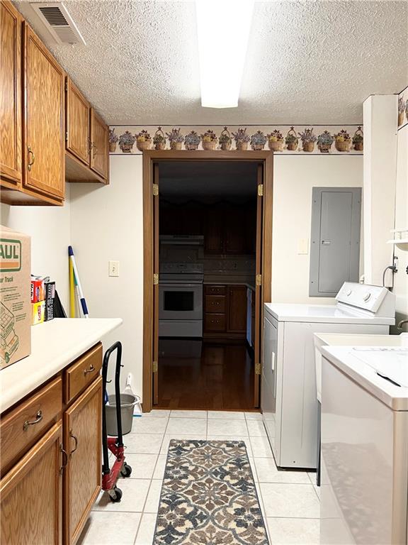 2850 Edgecliff Road, Unit 35 Lower Burrell, PA 15068 - Photo 13 of 27 Laundry area. Washer and dryer included. Nice cabinetry and counter top workspace.