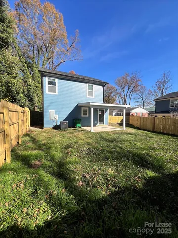 a view of house with yard