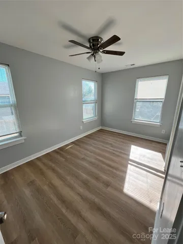 a view of an empty room and a window