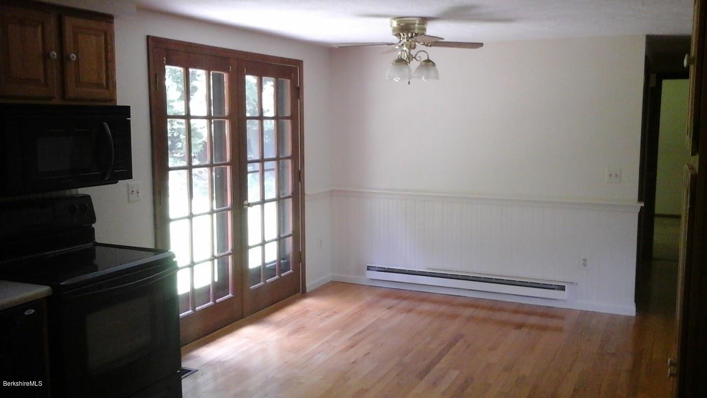 26 Goose Pond Road Tyringham, MA 01238 - Photo 22 of 23 a view of an empty room with a window