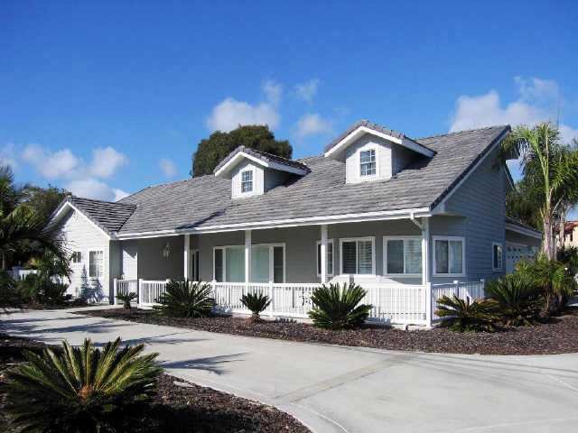 1551 Gascony Road Encinitas, CA 92024 - Photo 1 of 1 a front view of a house with a yard
