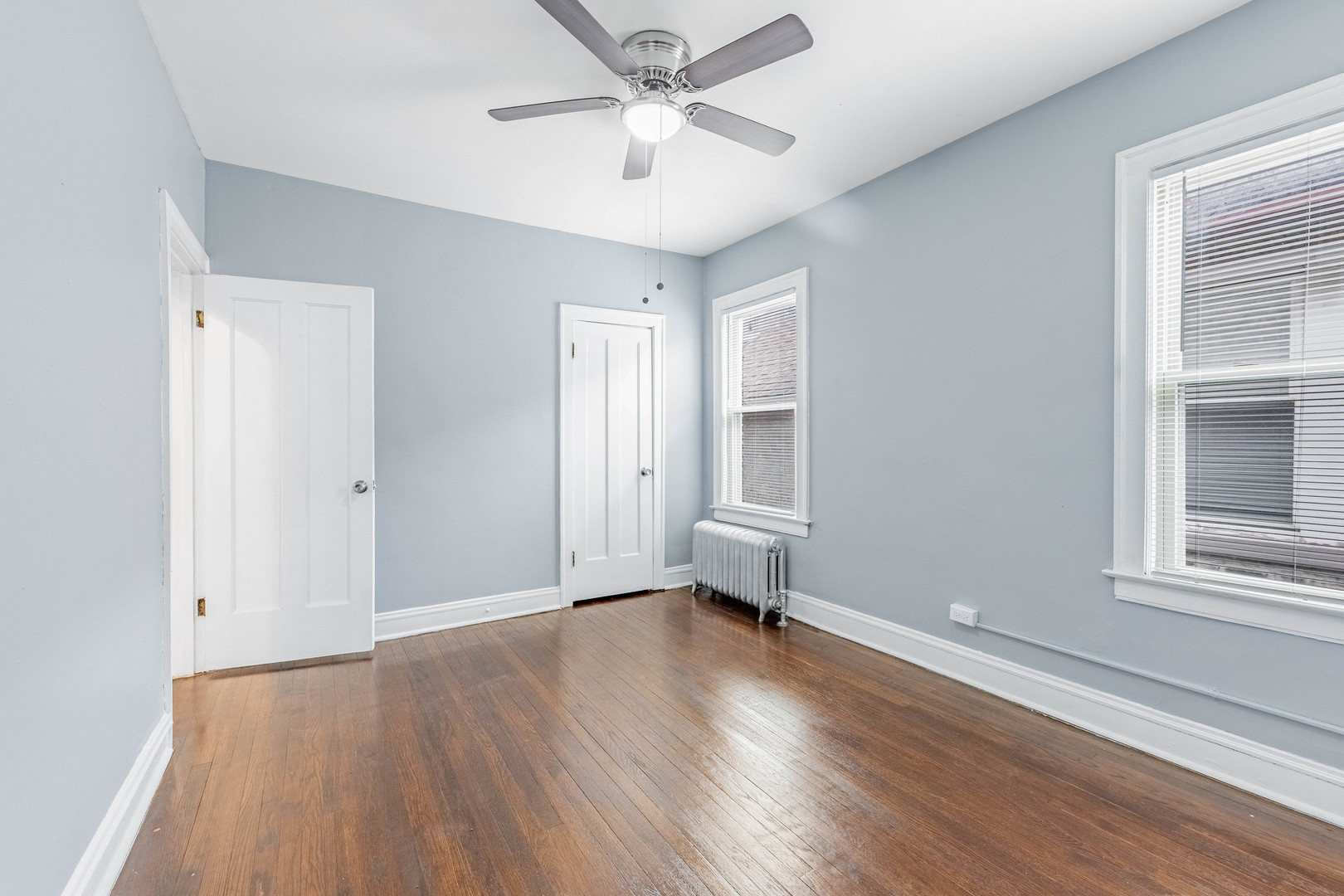 7729 South Laflin Street Chicago, IL 60620 - Photo 20 of 44 wooden floor in an empty room with a window