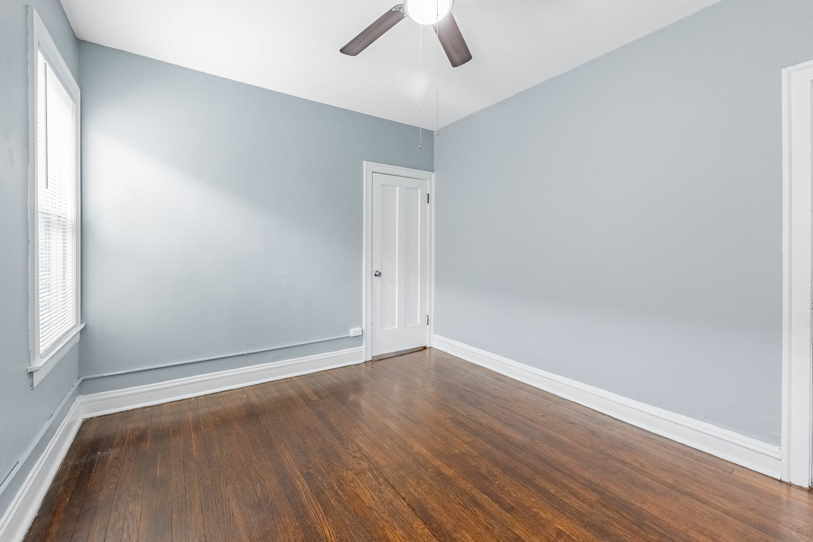 7729 South Laflin Street Chicago, IL 60620 - Photo 22 of 44 an empty room with ceiling fan and window