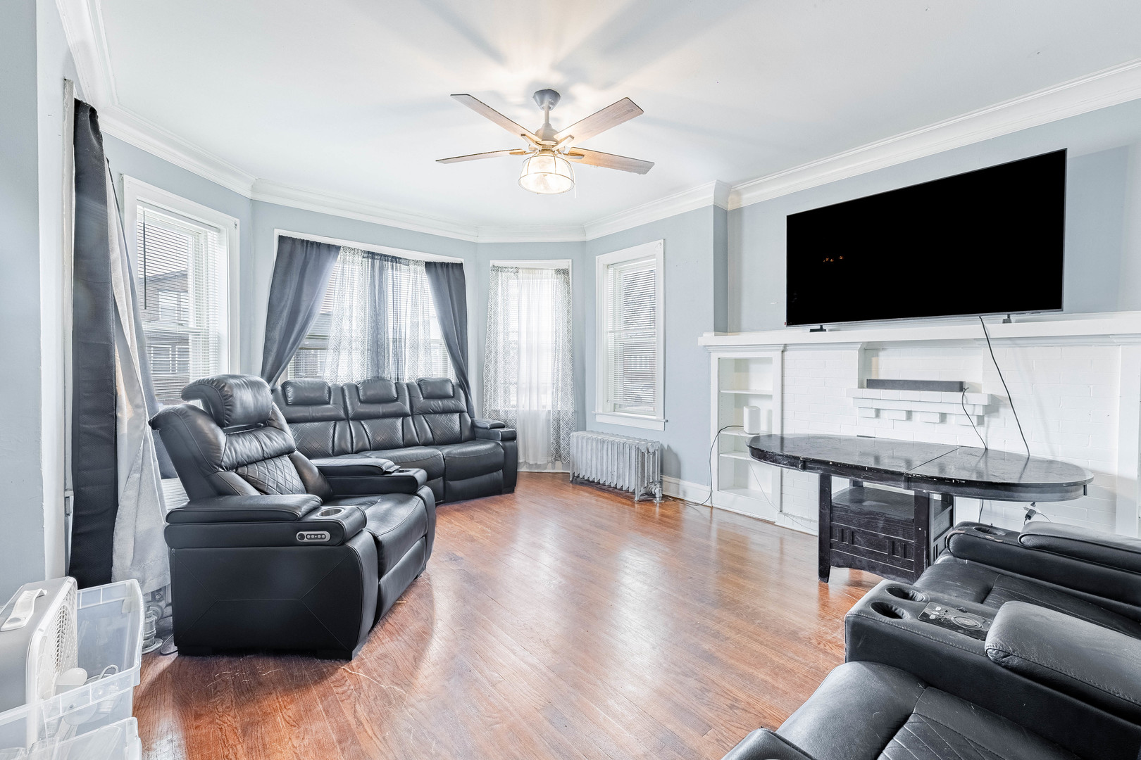 7729 South Laflin Street Chicago, IL 60620 - Photo 25 of 44 a living room with furniture and a flat screen tv