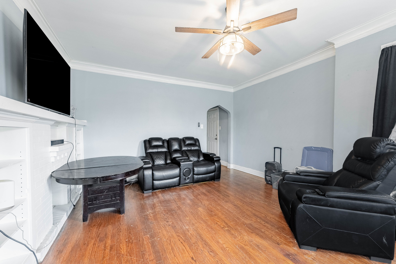 7729 South Laflin Street Chicago, IL 60620 - Photo 27 of 44 a living room with furniture and a flat screen tv