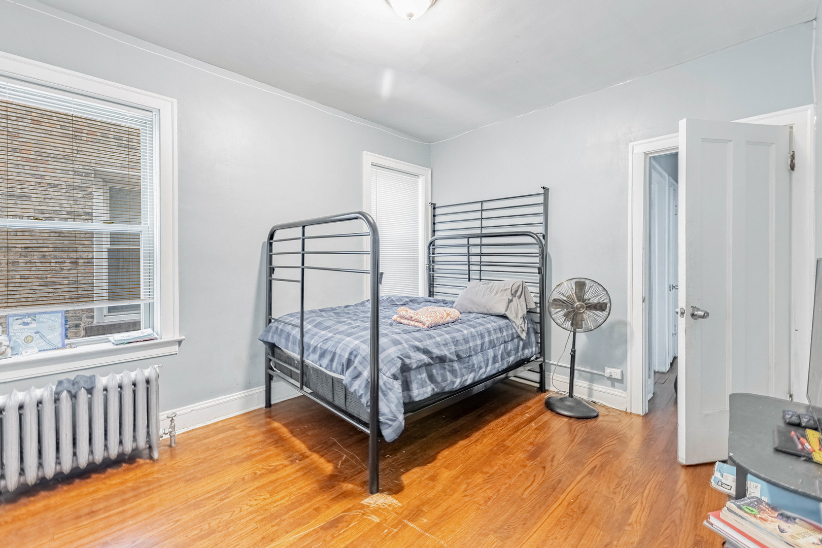 7729 South Laflin Street Chicago, IL 60620 - Photo 29 of 44 a bedroom with a bed and a window