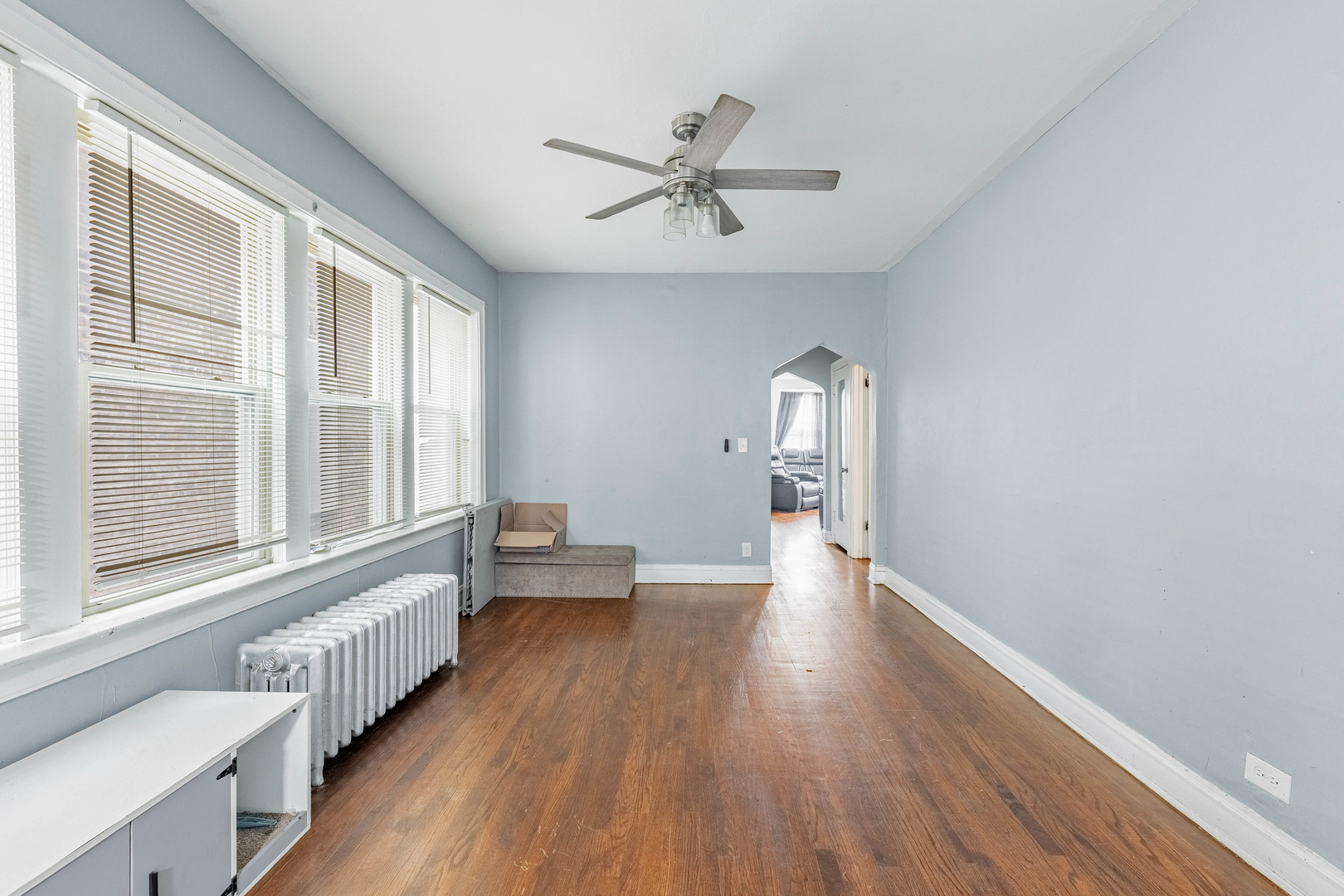 7729 South Laflin Street Chicago, IL 60620 - Photo 31 of 44 a view of empty room with wooden floor and fan