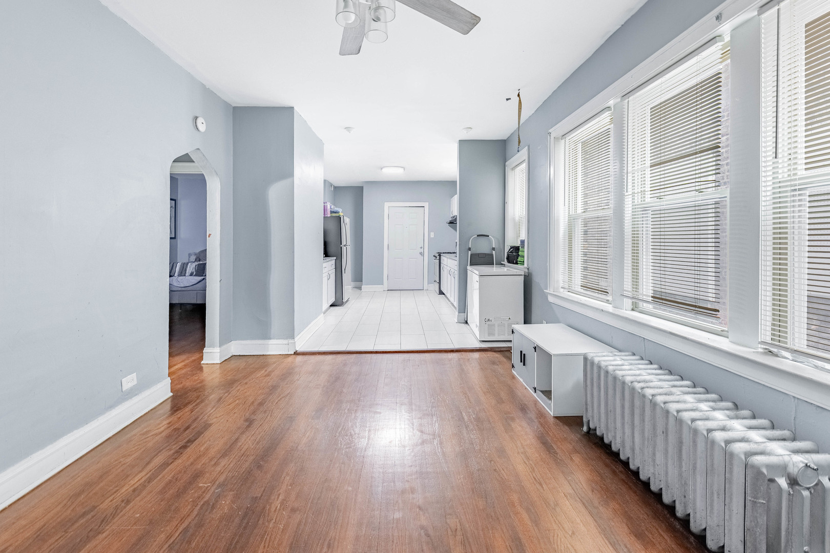 7729 South Laflin Street Chicago, IL 60620 - Photo 37 of 44 a view of a room with wooden floor and a window