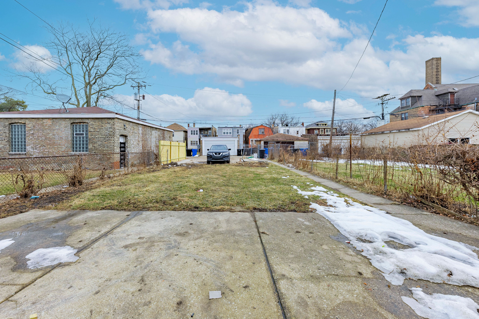 7729 South Laflin Street Chicago, IL 60620 - Photo 43 of 44 a view of a house with a yard