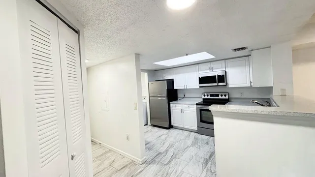 $293,400 | 5025 Wiles Road, Unit 107, Coconut Creek, FL 33073