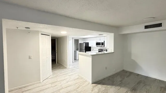 a kitchen with a stove and a microwave