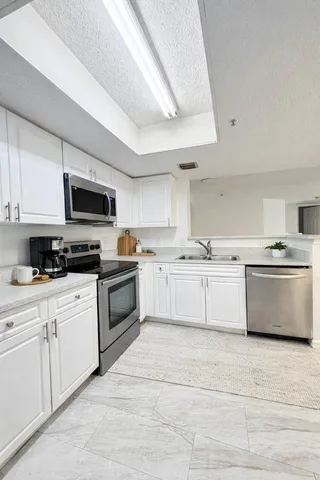 $275,900 | 5025 Wiles Road, Unit 107, Coconut Creek, FL 33073