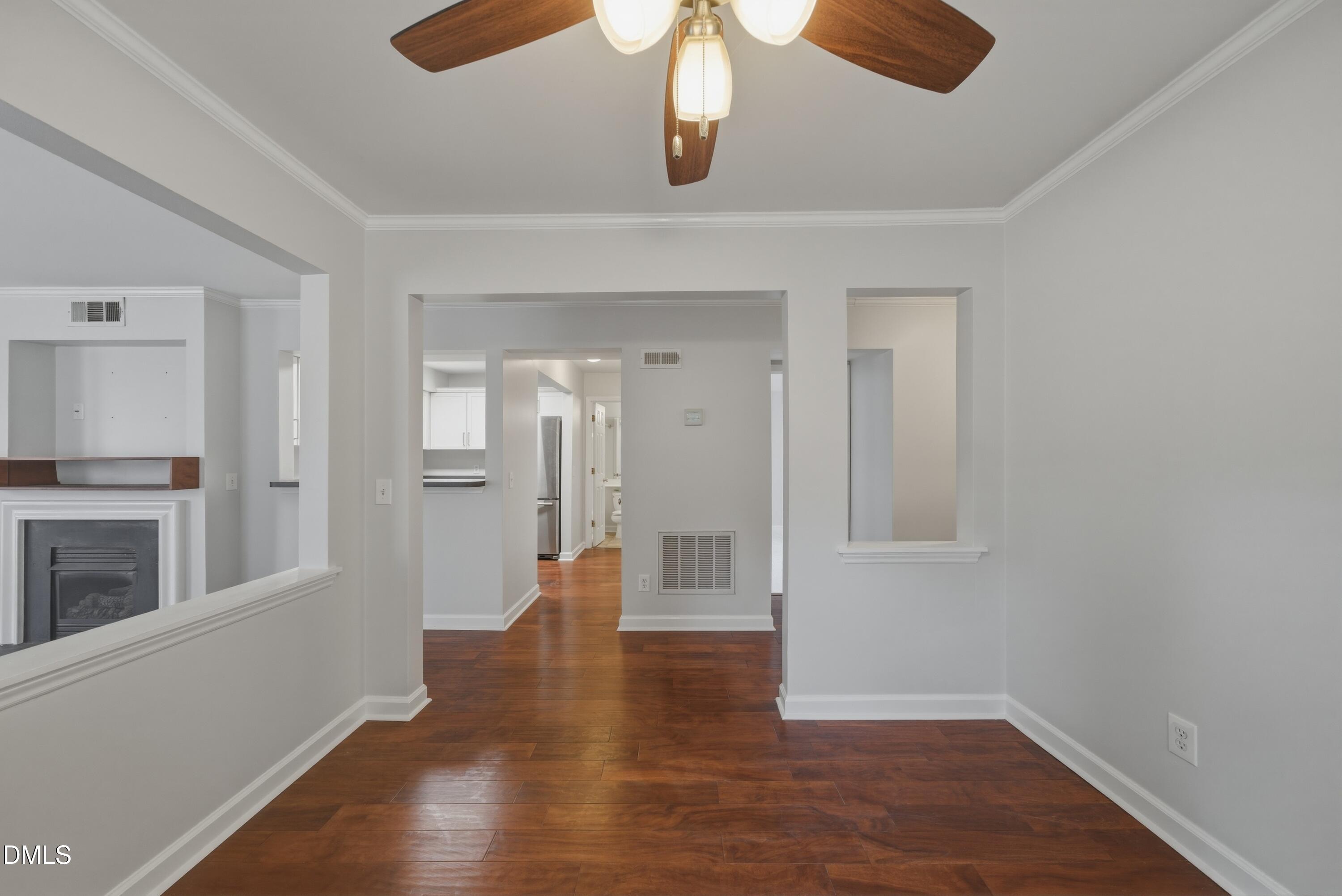 1201 Westview Lane, Unit 105 Raleigh, NC 27605 - Photo 14 of 24 a view of an empty room with wooden floor and a window