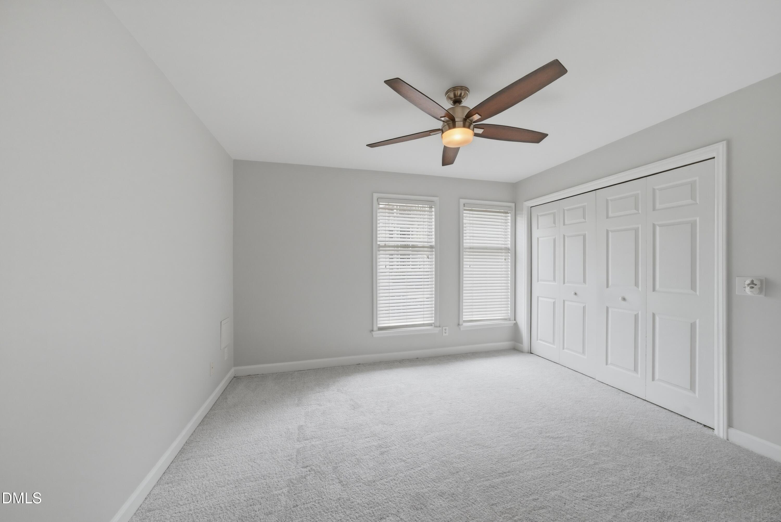 1201 Westview Lane, Unit 105 Raleigh, NC 27605 - Photo 15 of 24 a view of a livingroom with a ceiling fan and window