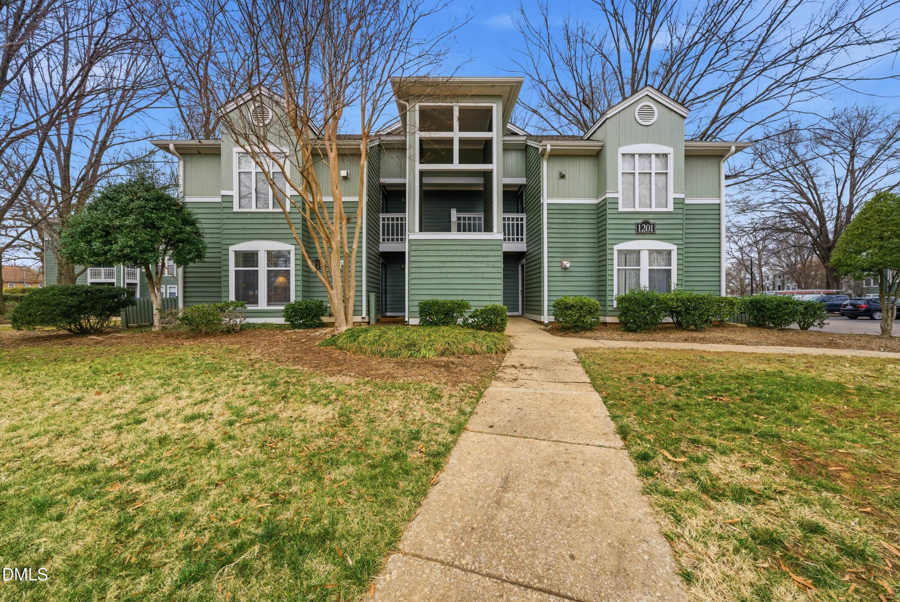 1201 Westview Lane, Unit 105 Raleigh, NC 27605 - Photo 2 of 24 a front view of a house with a yard