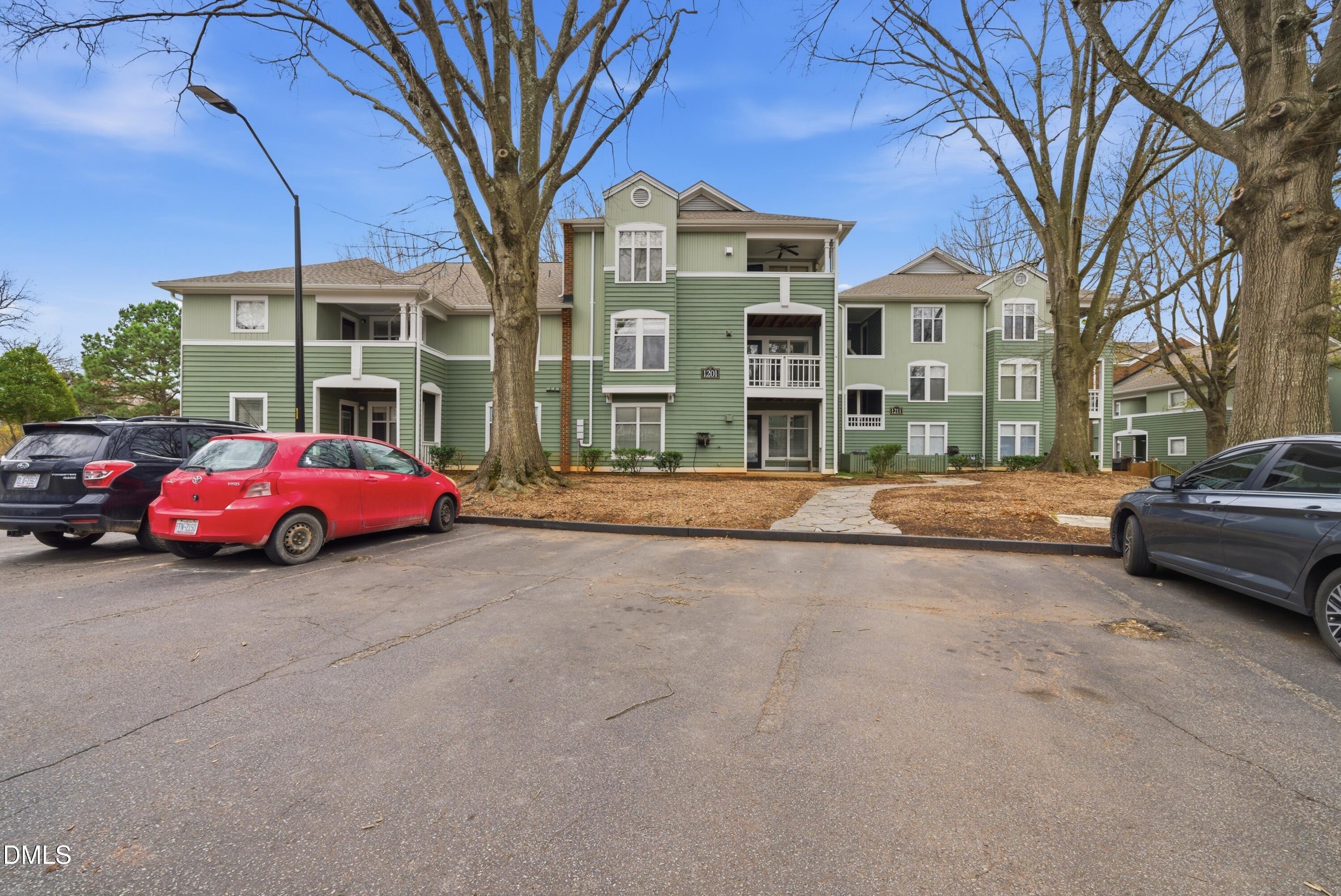 1201 Westview Lane, Unit 105 Raleigh, NC 27605 - Photo 24 of 24 a cars parked in front of a building