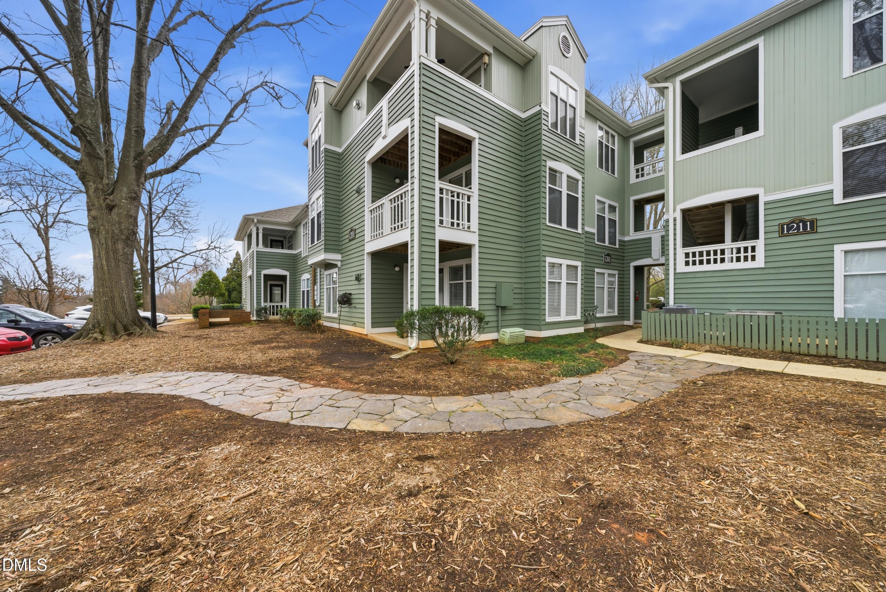 1201 Westview Lane, Unit 105 Raleigh, NC 27605 - Photo 3 of 24 a view of a house with a yard