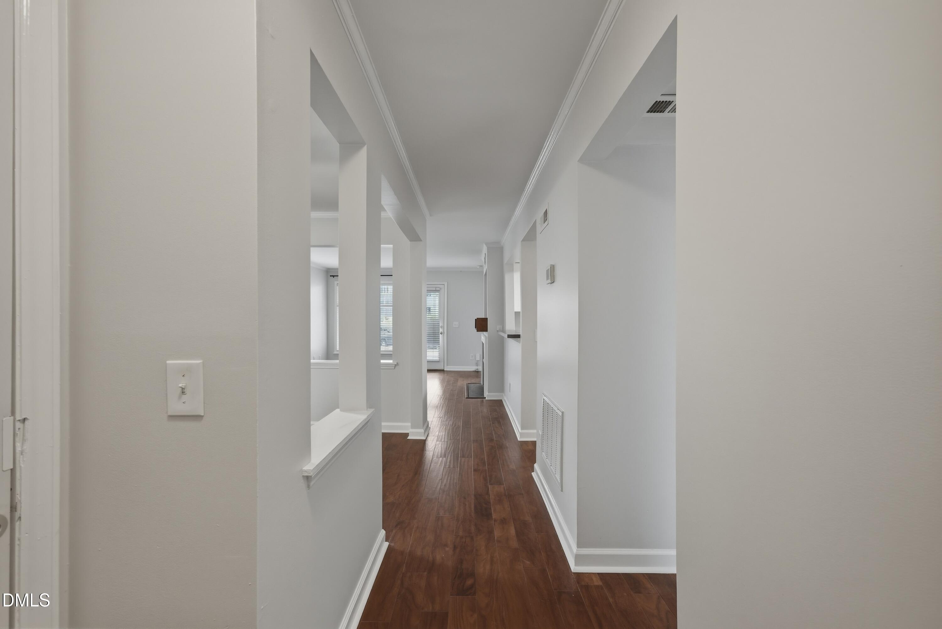 1201 Westview Lane, Unit 105 Raleigh, NC 27605 - Photo 5 of 24 a view of a hallway with wooden floor