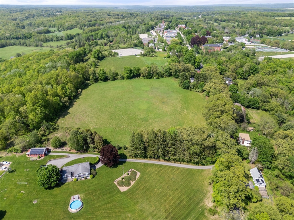 0 Center Road Dudley, MA 01571 - Photo 7 of 12 an aerial view of residential houses with outdoor space