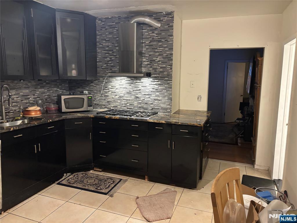 109 Centre Avenue, Unit FIRST Secaucus, NJ 07094 - Photo 1 of 14 a kitchen with a sink and cabinets