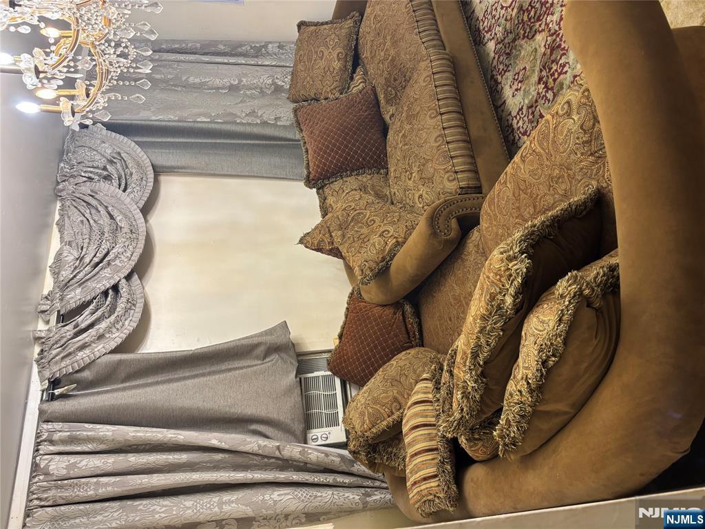 109 Centre Avenue, Unit FIRST Secaucus, NJ 07094 - Photo 3 of 14 a living room with furniture and a couch