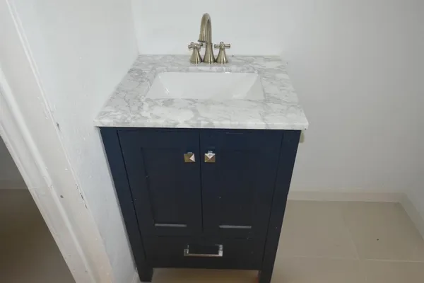 a bathroom with a sink and toilet