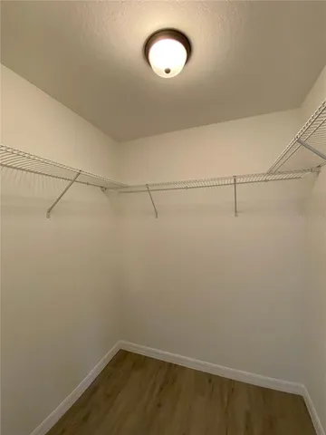 a view of a room with racks on the wall