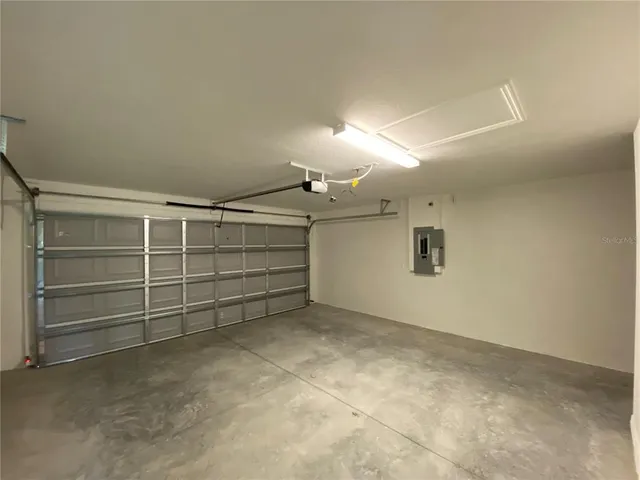 a view of room that has a car parked in it