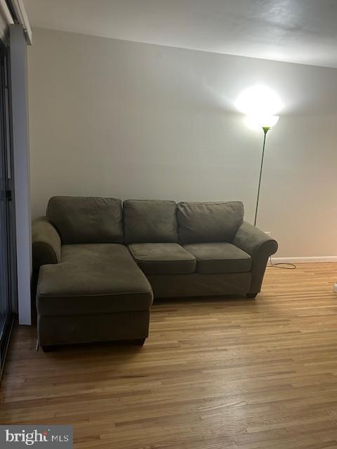 1600 Church Road, Unit C301 Wyncote, PA 19095 - Photo 2 of 11 a living room with furniture and a wooden floor