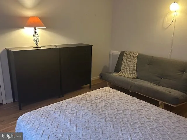 a bedroom with a bed and lamp