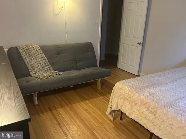 a living room with a couch and a rug