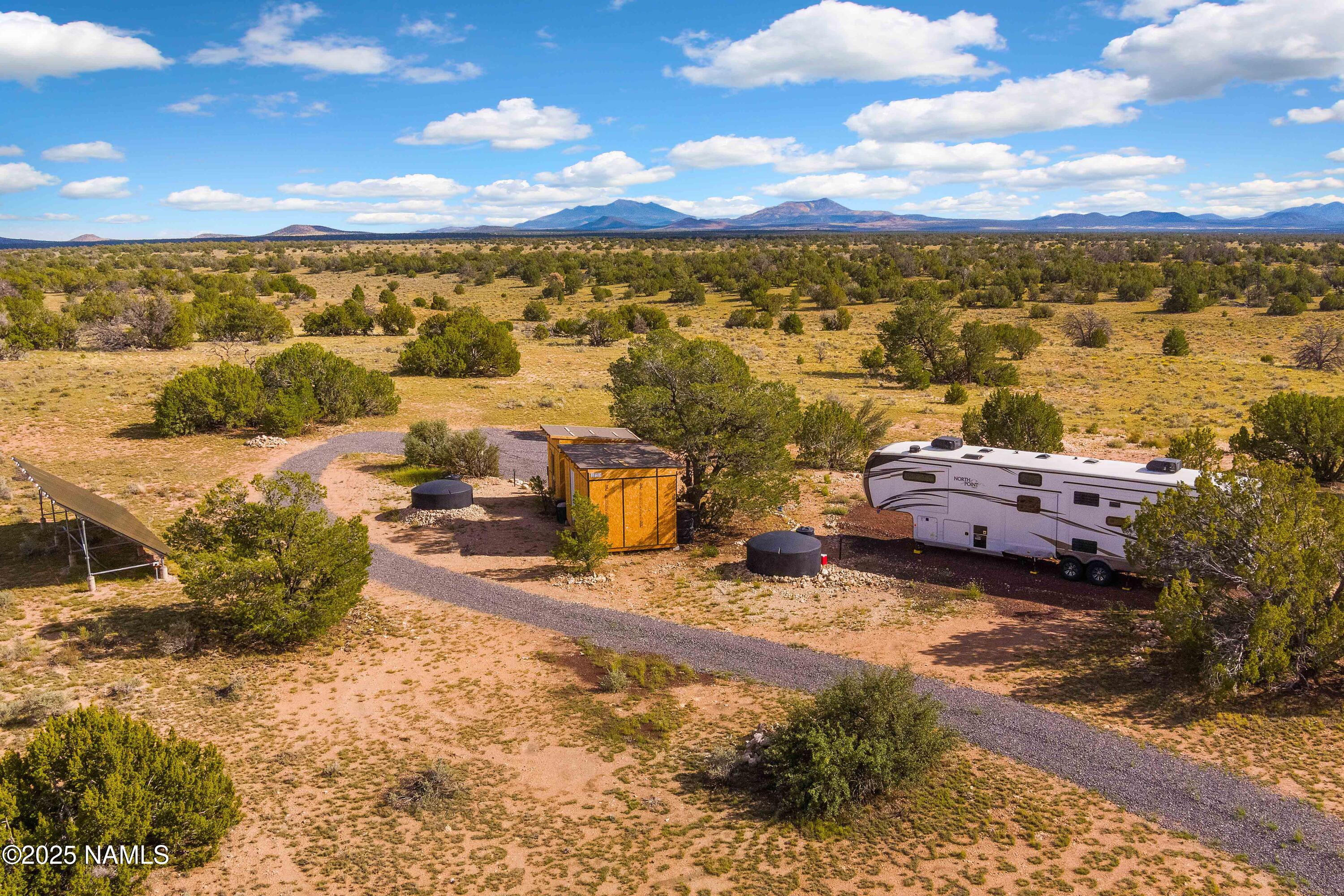 3097 North Peakview Road, Unit LOT A Williams, AZ 86046 - Photo 18 of 36 a view of a terrace with lawn chairs